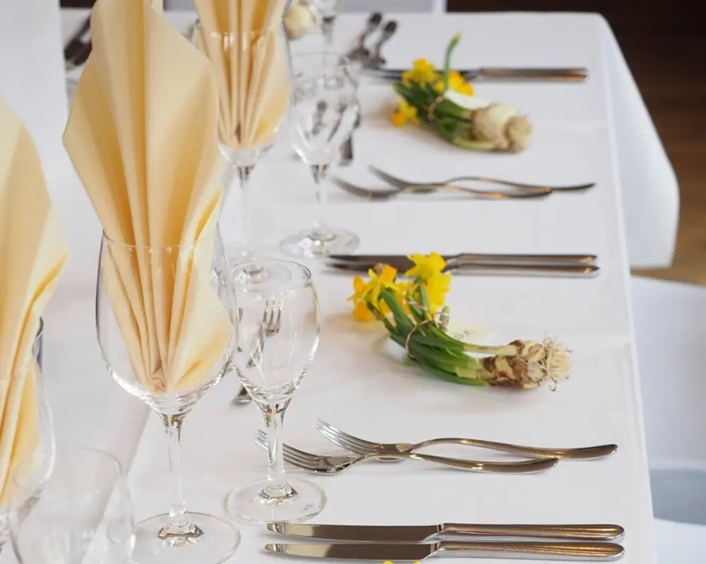 A table laid for dinner service in the Babuka dining room